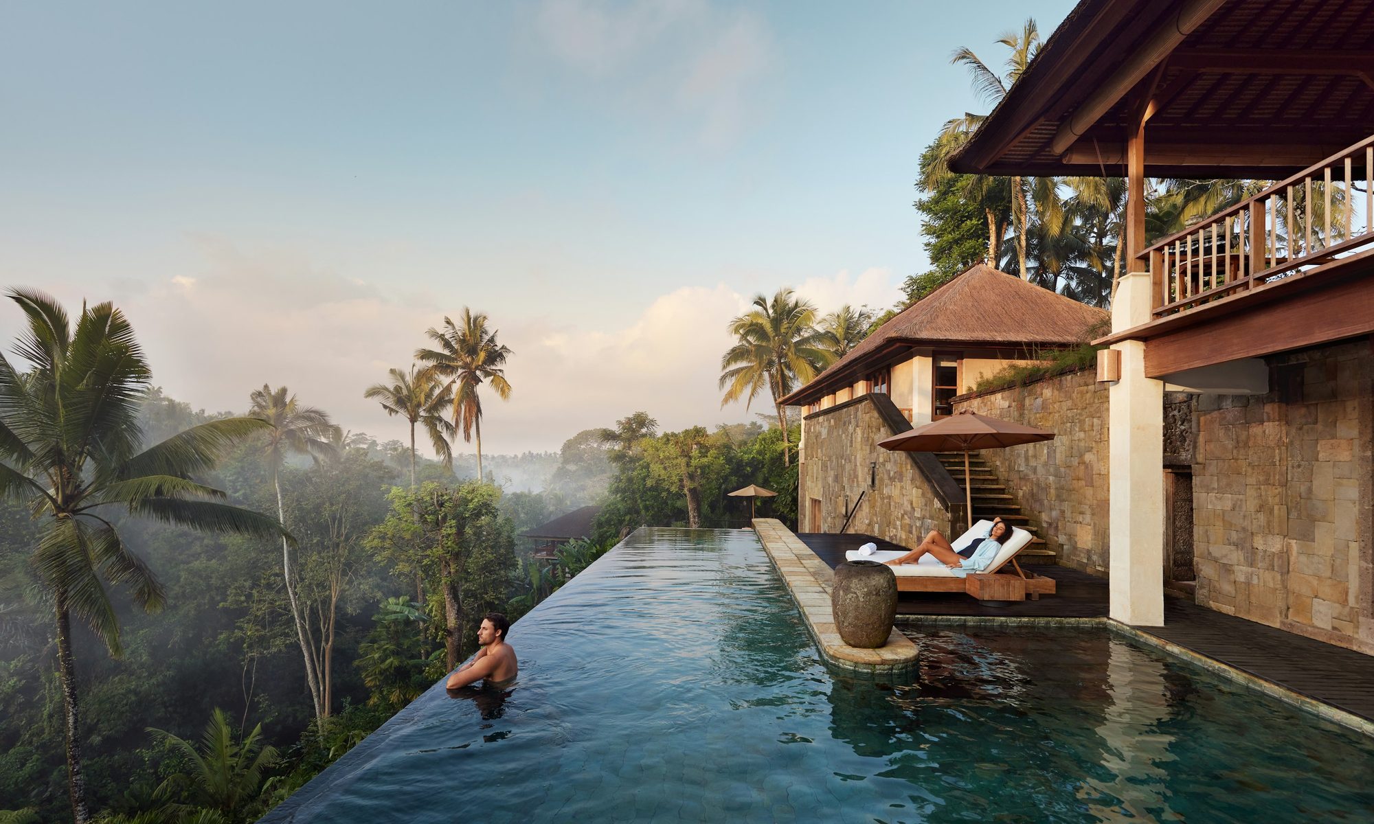 Aerial view of a Residence pool at Como Shambhala Estate, guests relaxing poolside