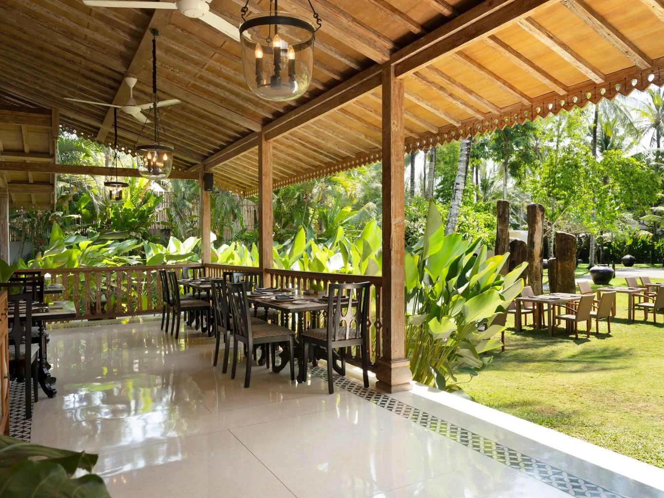 The veranda of the restaurant at Kayumanis Jimbaran, overlooking the tropical garden