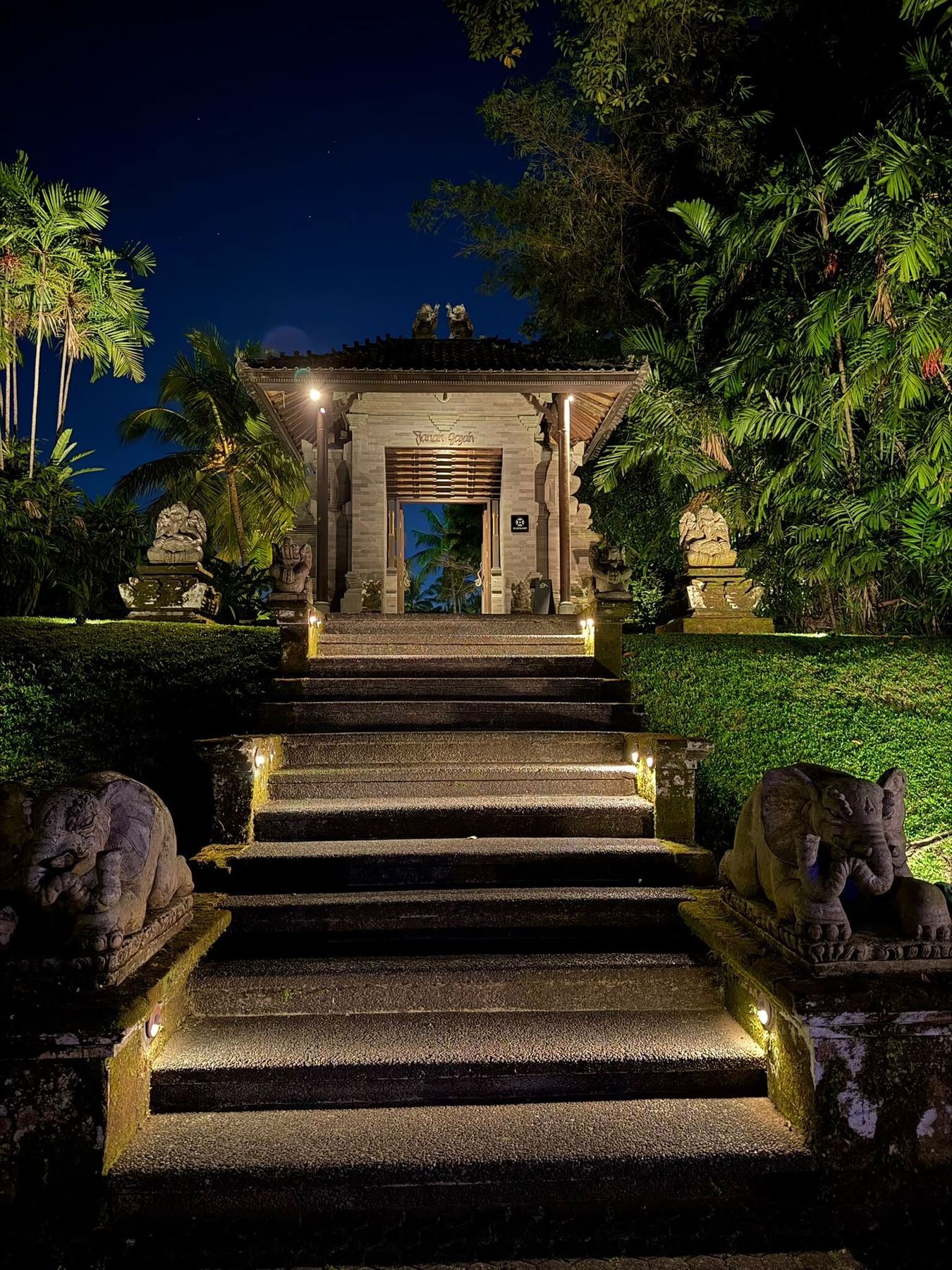 Entrance gate at Tanah Gajah, lit for evening
